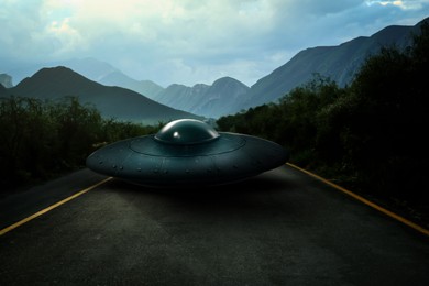 UFO. Alien spaceship on asphalt highway outdoors. Extraterrestrial visitors