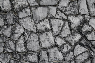 Texture of grey stone wall as background