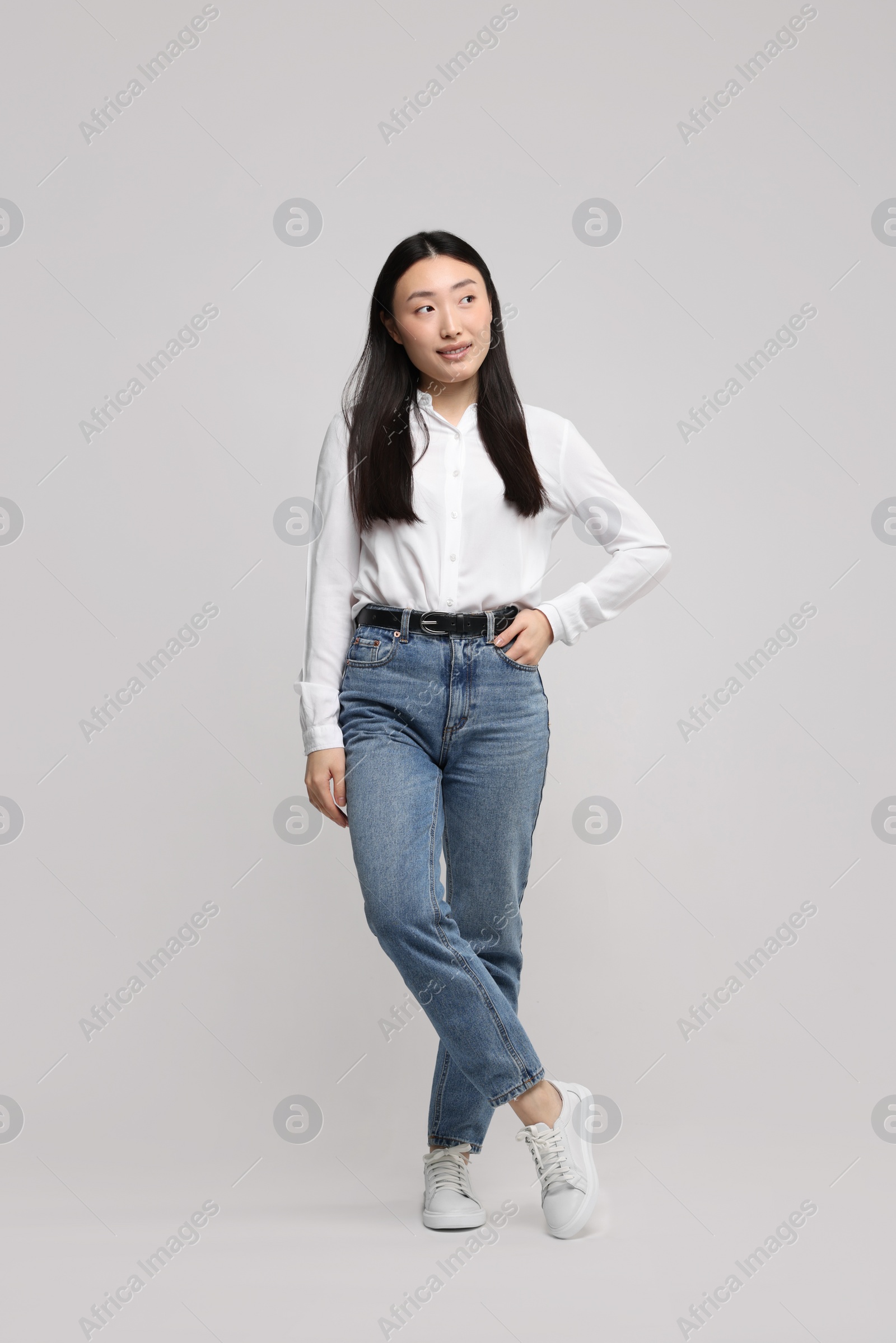 Photo of Full length portrait of beautiful woman on light background