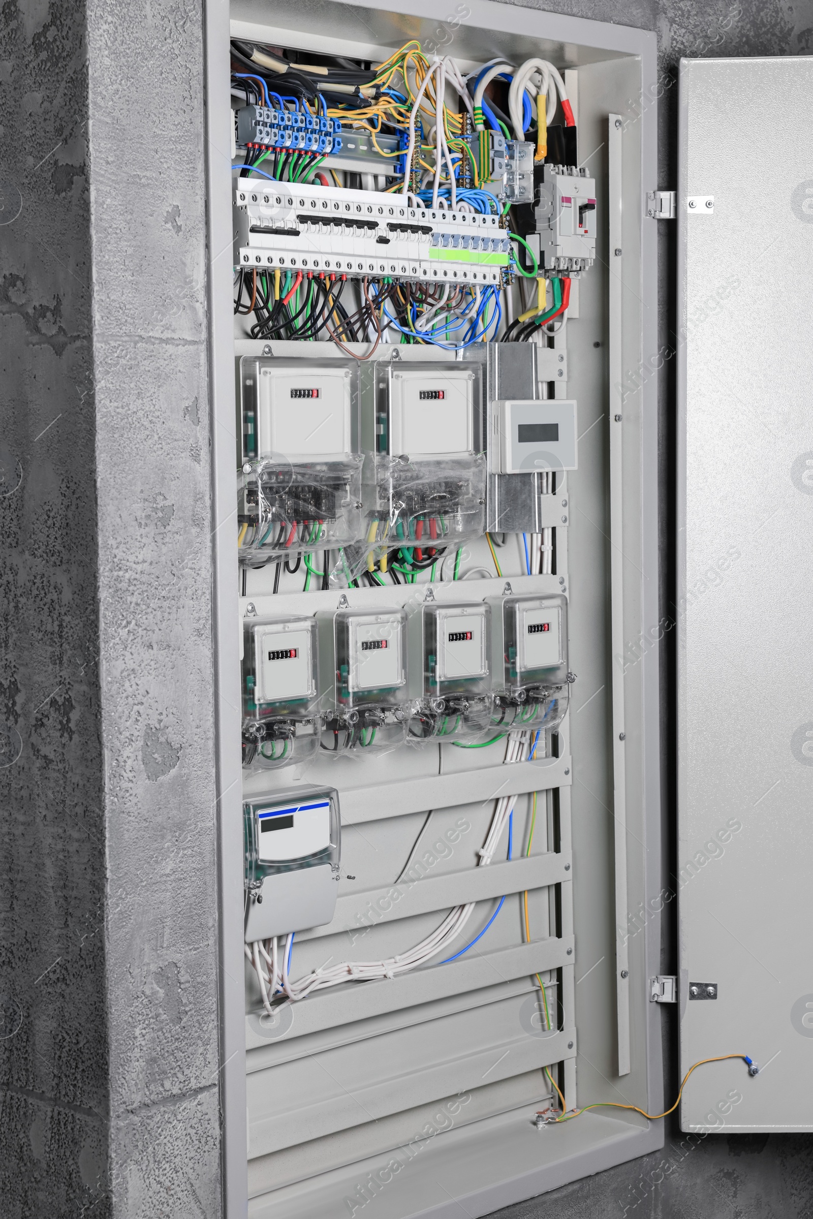 Photo of Fuse box with many electric meters and wires