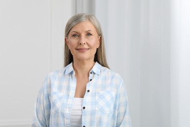 Photo of Portrait of beautiful senior woman with gray hair indoors
