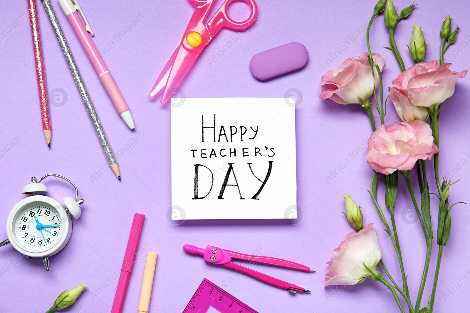 Photo of Flat lay composition with words HAPPY TEACHER'S DAY, stationery and flowers on violet background