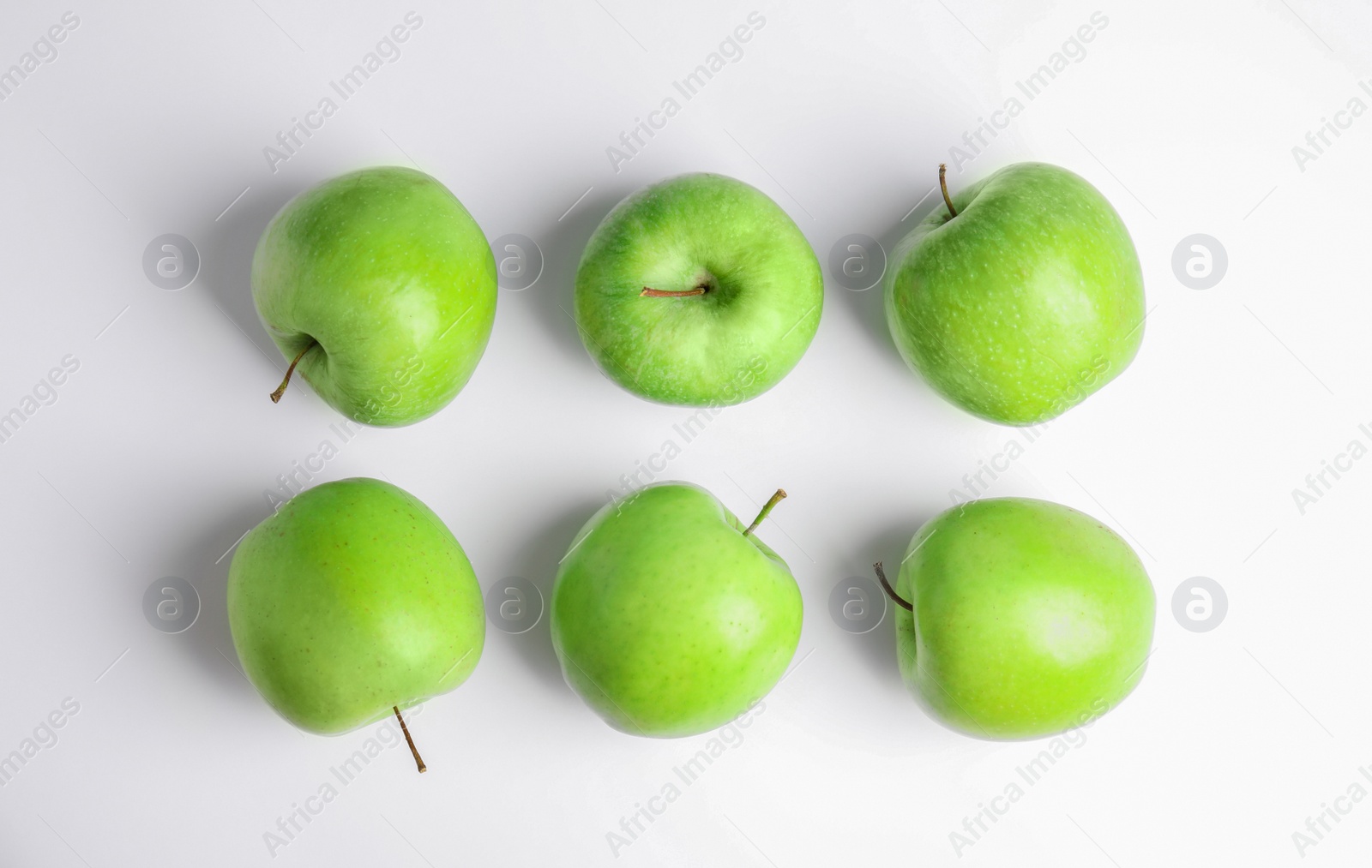 Photo of Fresh ripe green apples on white background, top view