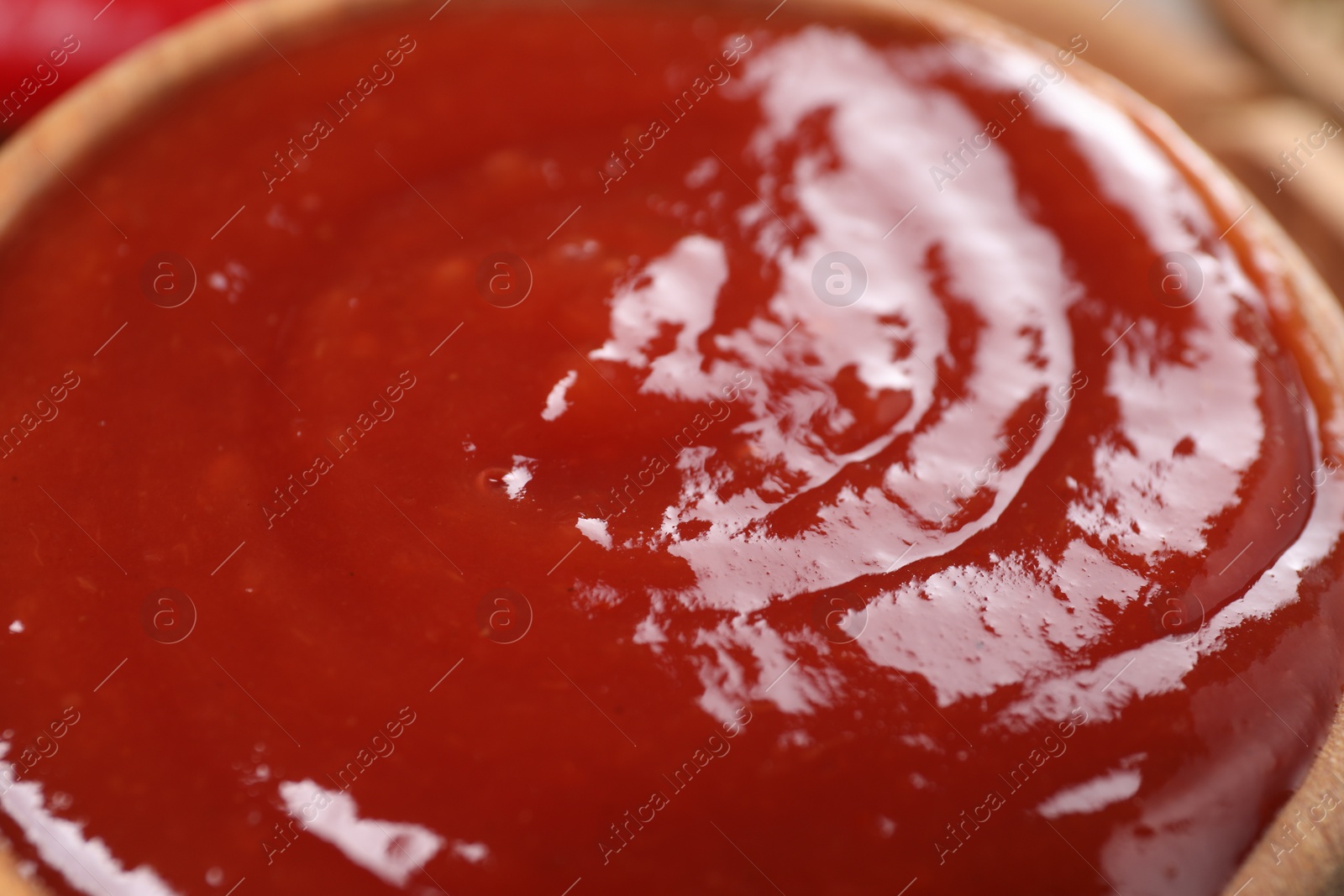 Photo of Delicious ketchup in bowl, closeup. Tomato sauce