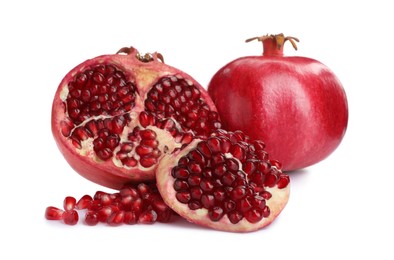 Photo of Ripe pomegranates on white background. Delicious fruits