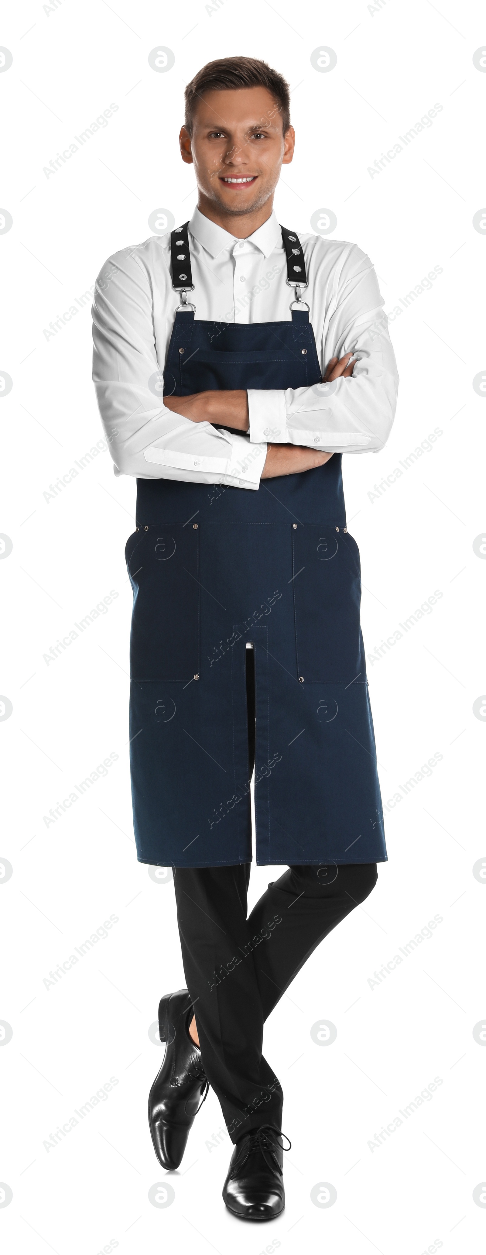 Photo of Full length portrait of happy young waiter in uniform on white background