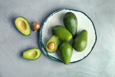 Photo of Flat lay composition with ripe avocados on grey background