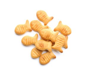 Photo of Delicious crispy goldfish crackers on white background, top view