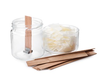 Photo of Wax flakes and wooden wicks on white background. Making homemade candle