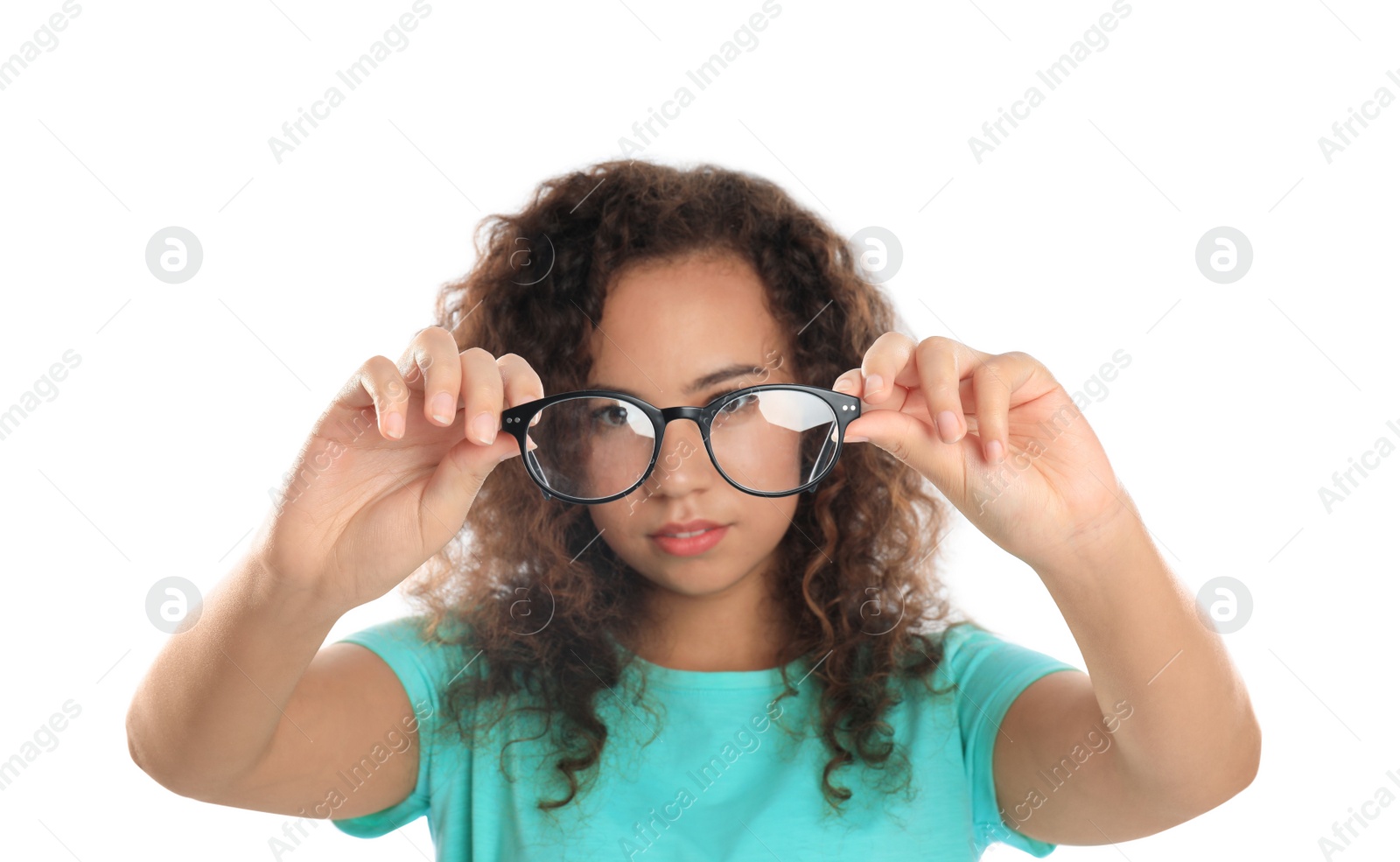 Photo of Young African-American woman looking through glasses on white background. Vision problems