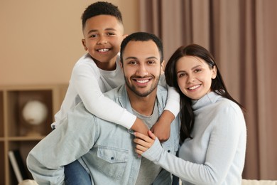 Photo of Happy international family spending time together at home