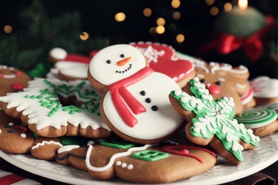 Delicious gingerbread Christmas cookies on plate, closeup