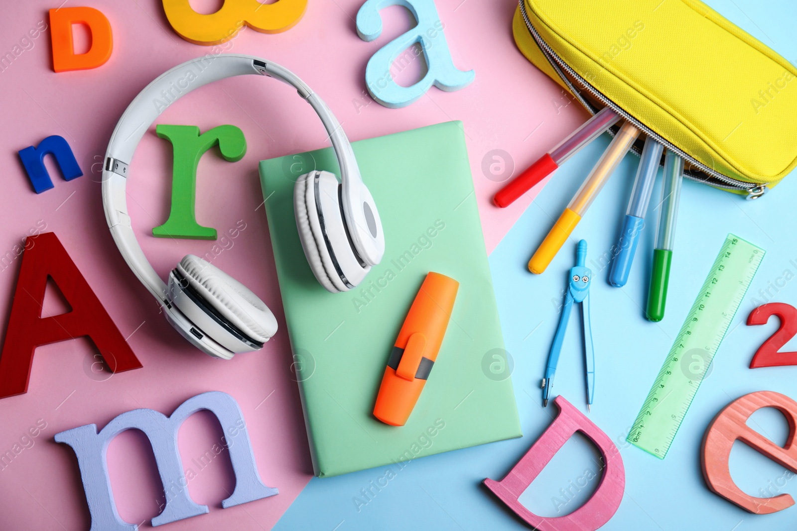 Photo of Flat lay composition with book and stationery on color background