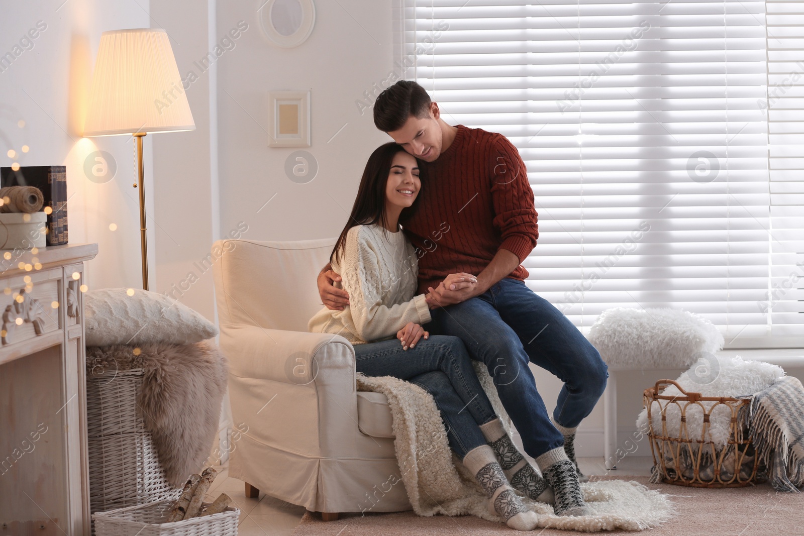 Photo of Happy couple spending time together at home. Winter vacation