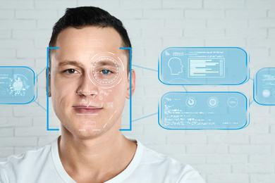 Facial recognition system. Man with scanner frame on face and information