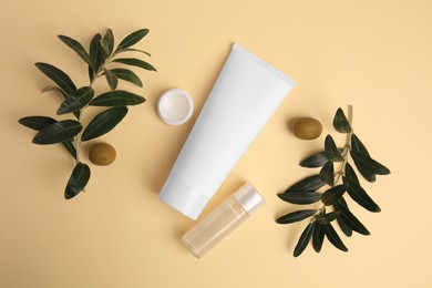 Photo of Different cosmetic products and ingredient on beige background, flat lay