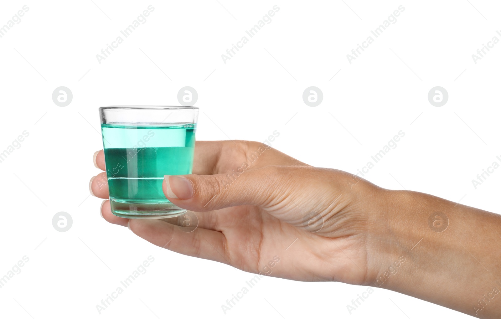 Photo of Woman holding glass with mouthwash for teeth care on white background