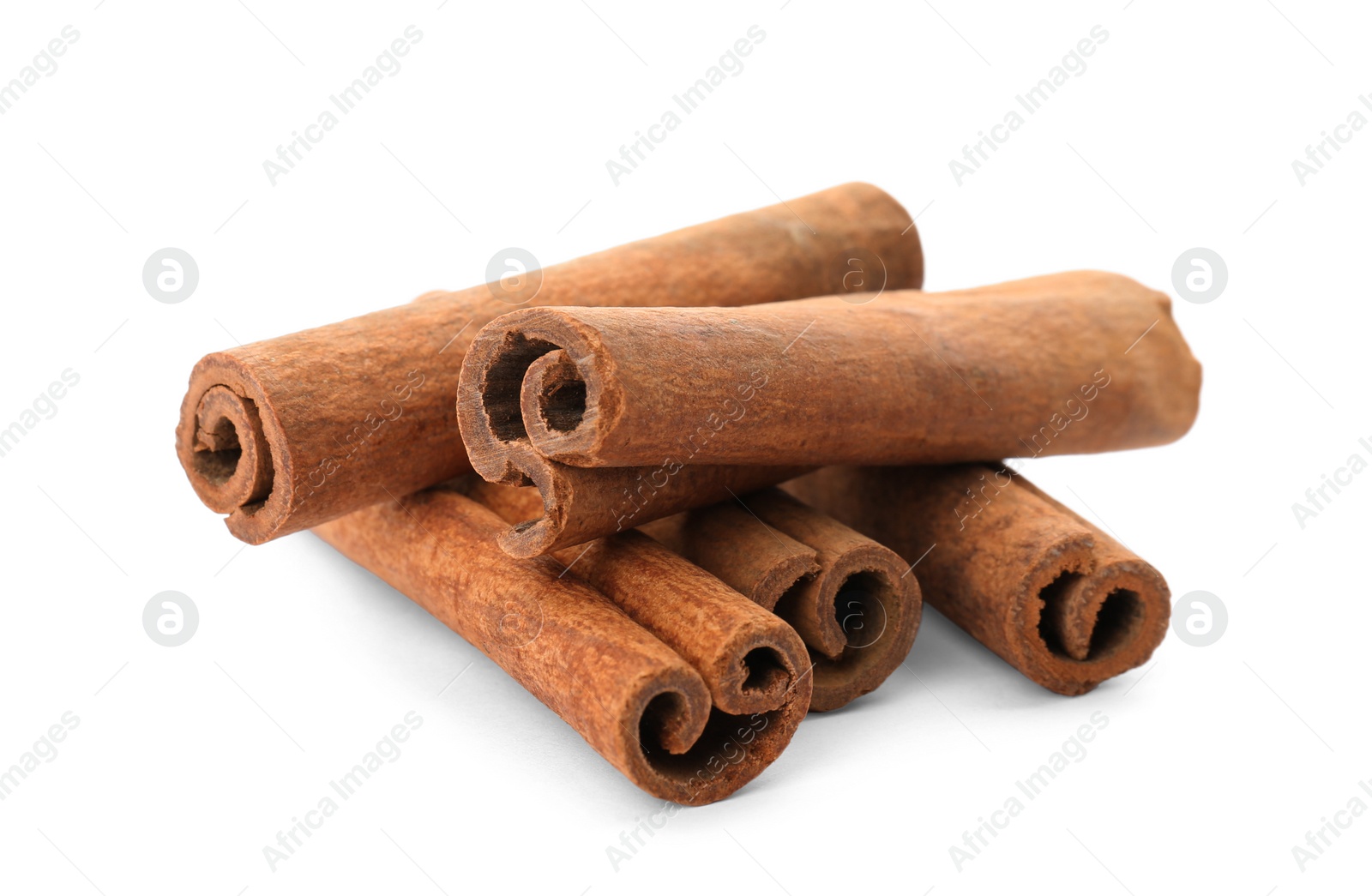 Photo of Aromatic cinnamon sticks on white background