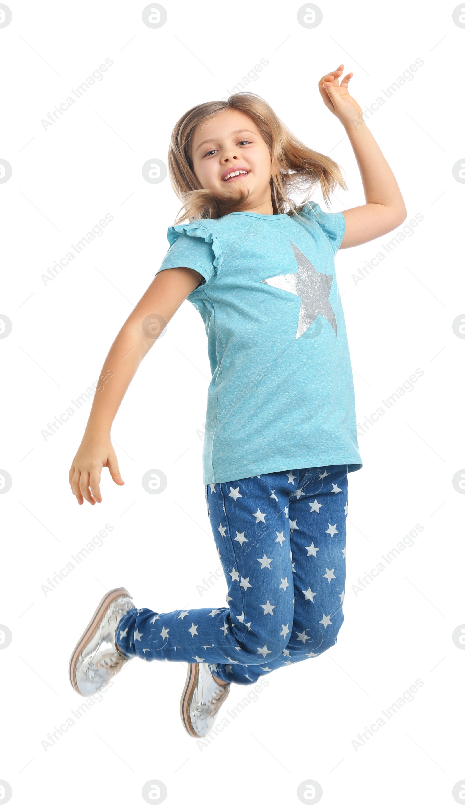 Photo of Cute little girl jumping on white background