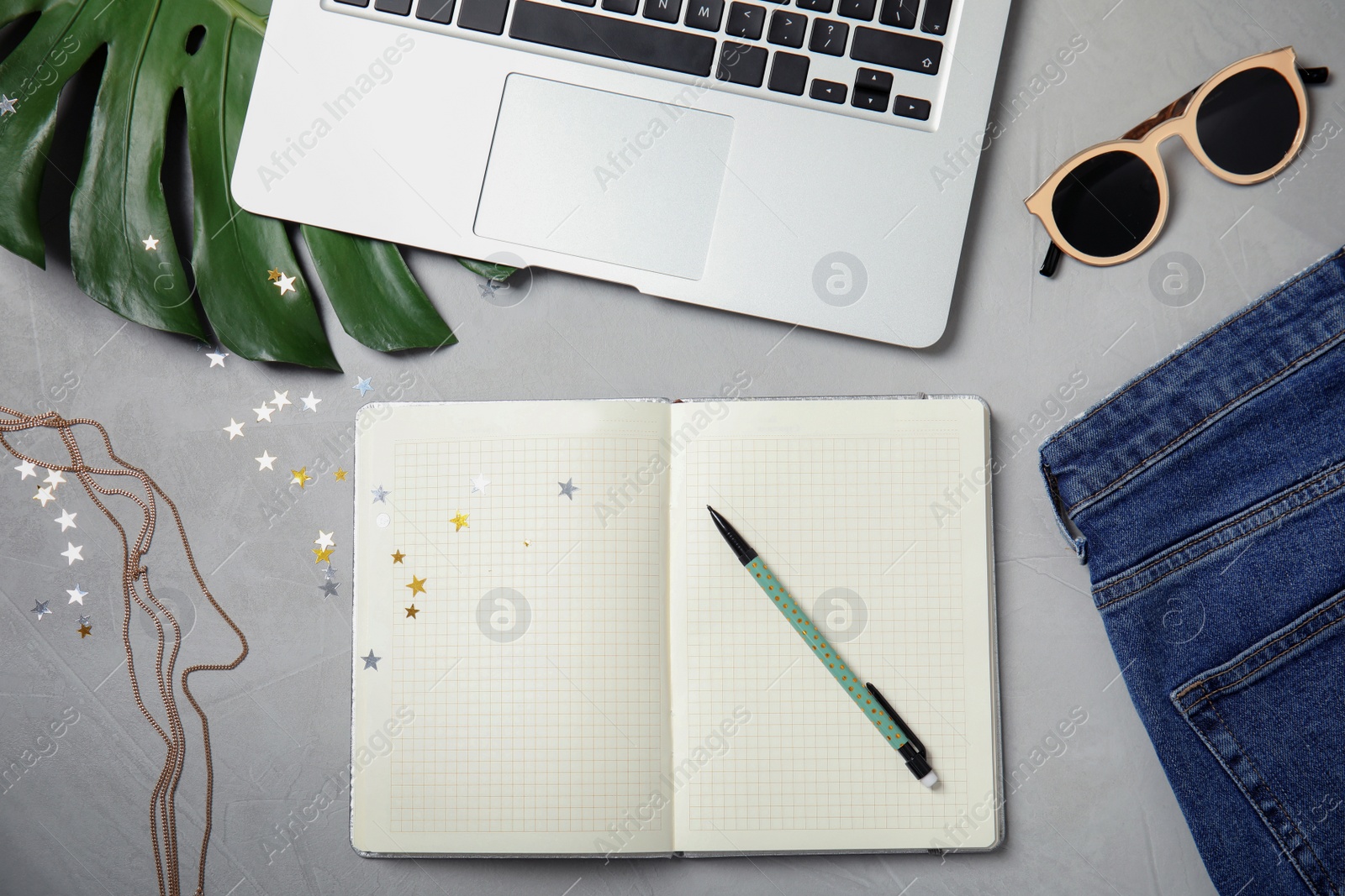 Photo of Flat lay composition with blank notebook on light background. Blogger's workplace