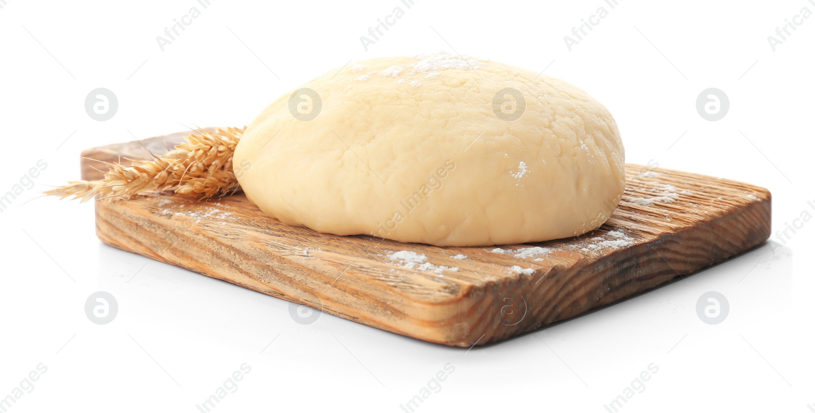 Photo of Wooden board with raw dough on white background