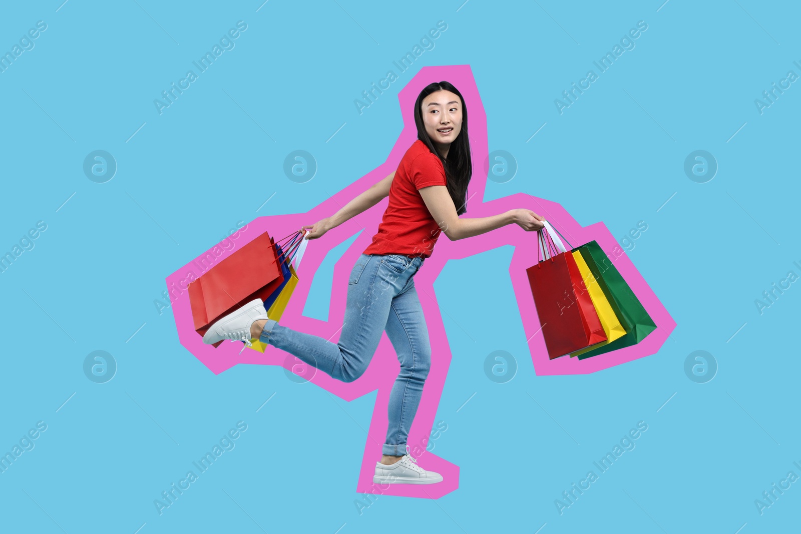 Image of Happy woman with shopping bags on light blue background