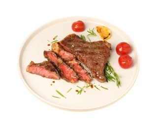 Photo of Plate with delicious grilled beef steak, tomatoes, rosemary and lemon slice isolated on white, above view