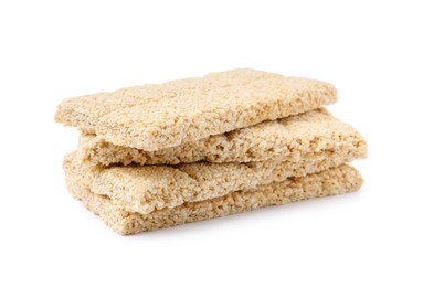 Photo of Tasty sesame kozinaki bars on white background