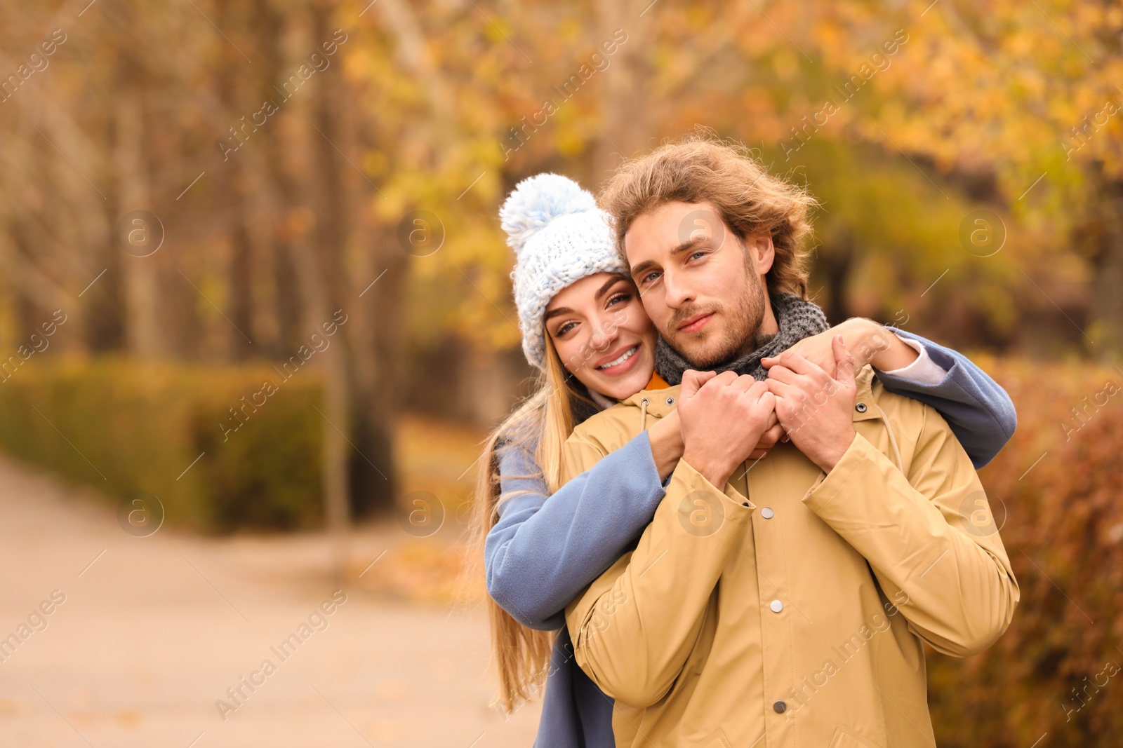 Photo of Young romantic couple in park on autumn day