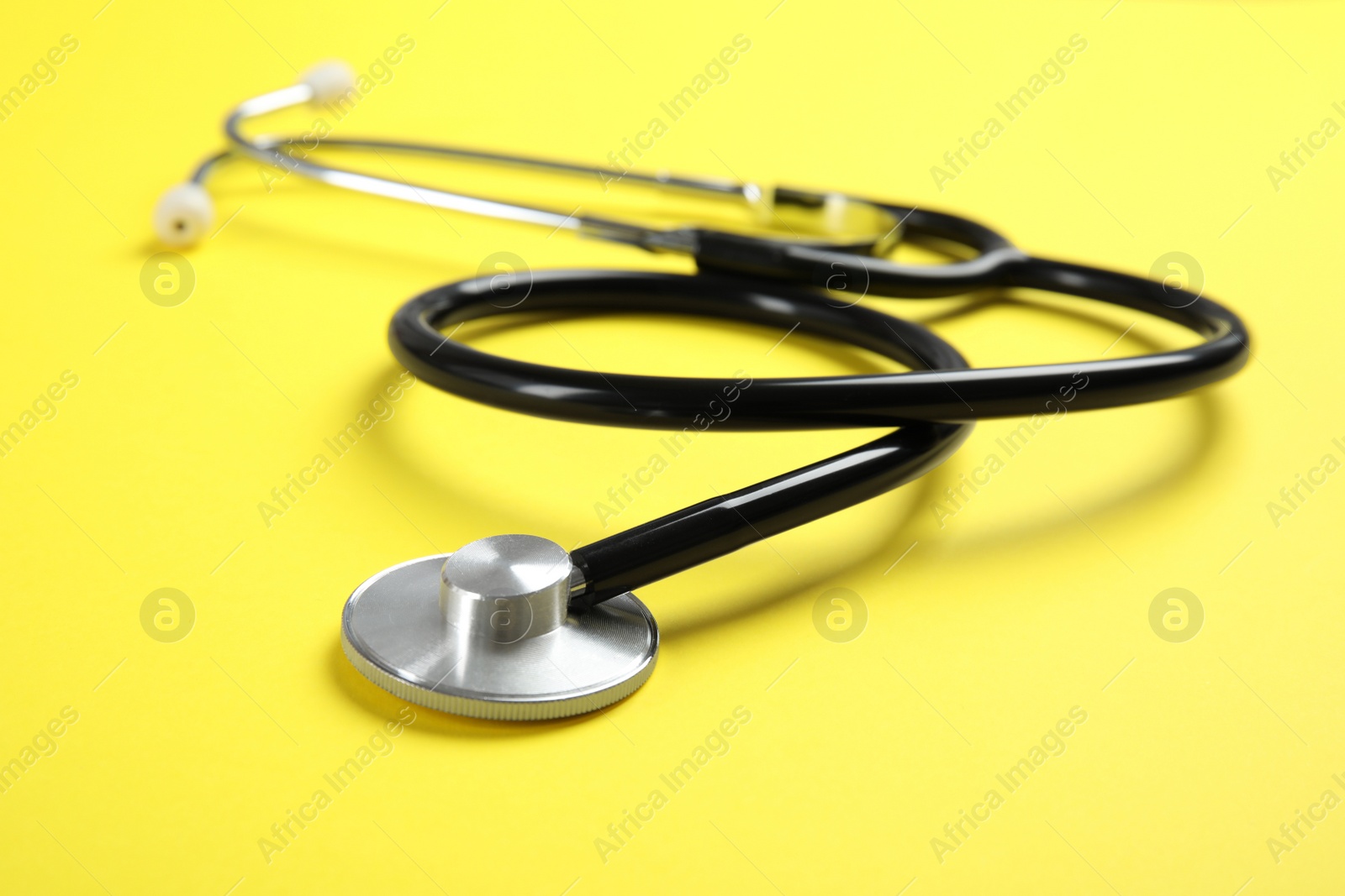 Photo of Stethoscope on color background, closeup. Medical tool