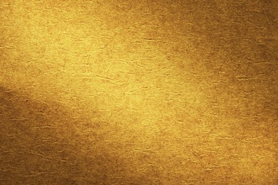 Image of Golden textured surface as background, closeup view