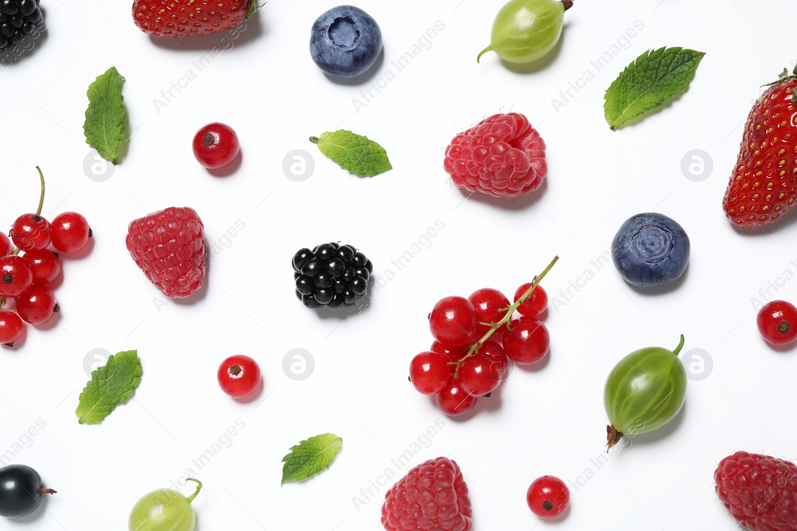 Photo of Mix of fresh berries on white background, flat lay