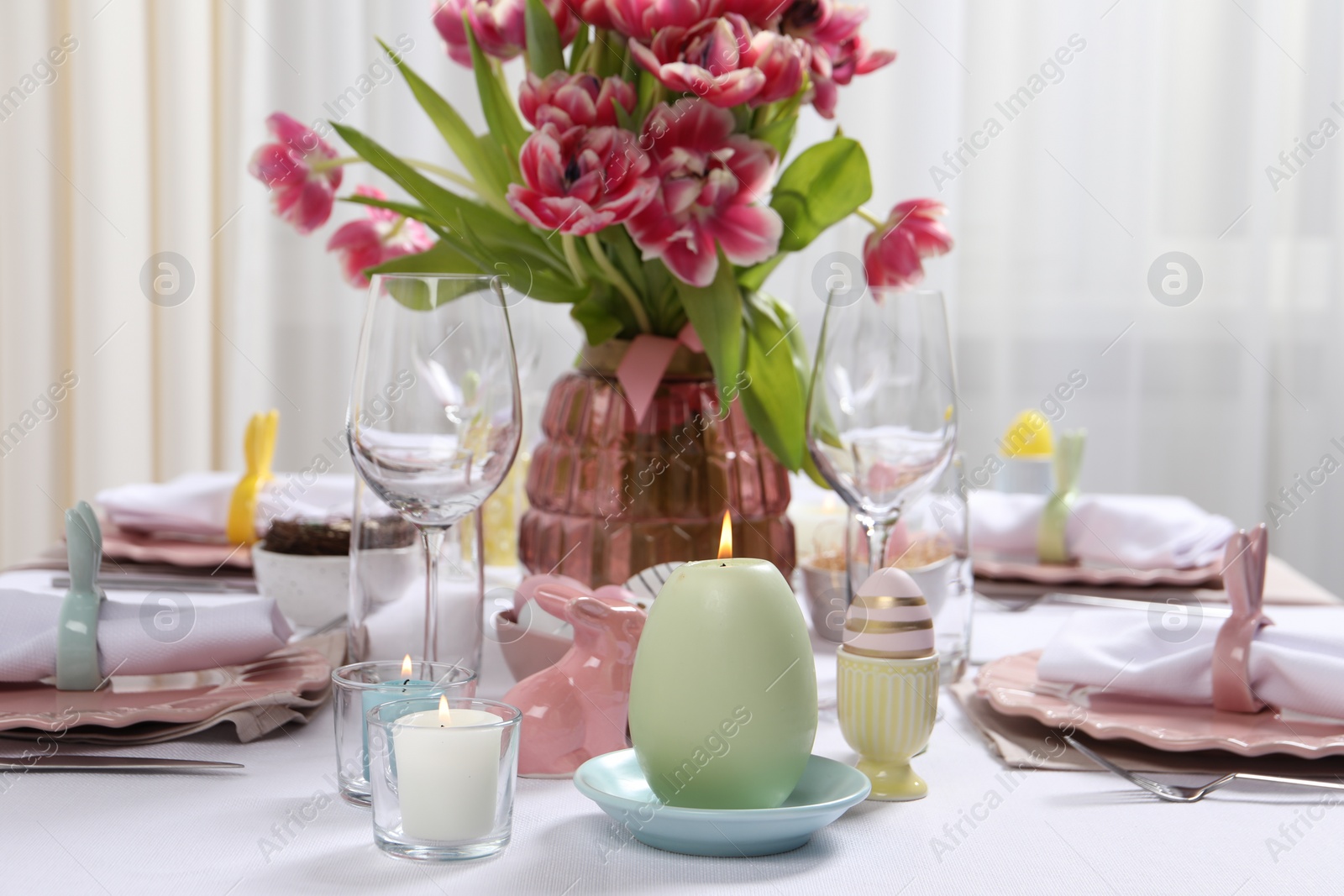 Photo of Festive table setting with beautiful flowers. Easter celebration