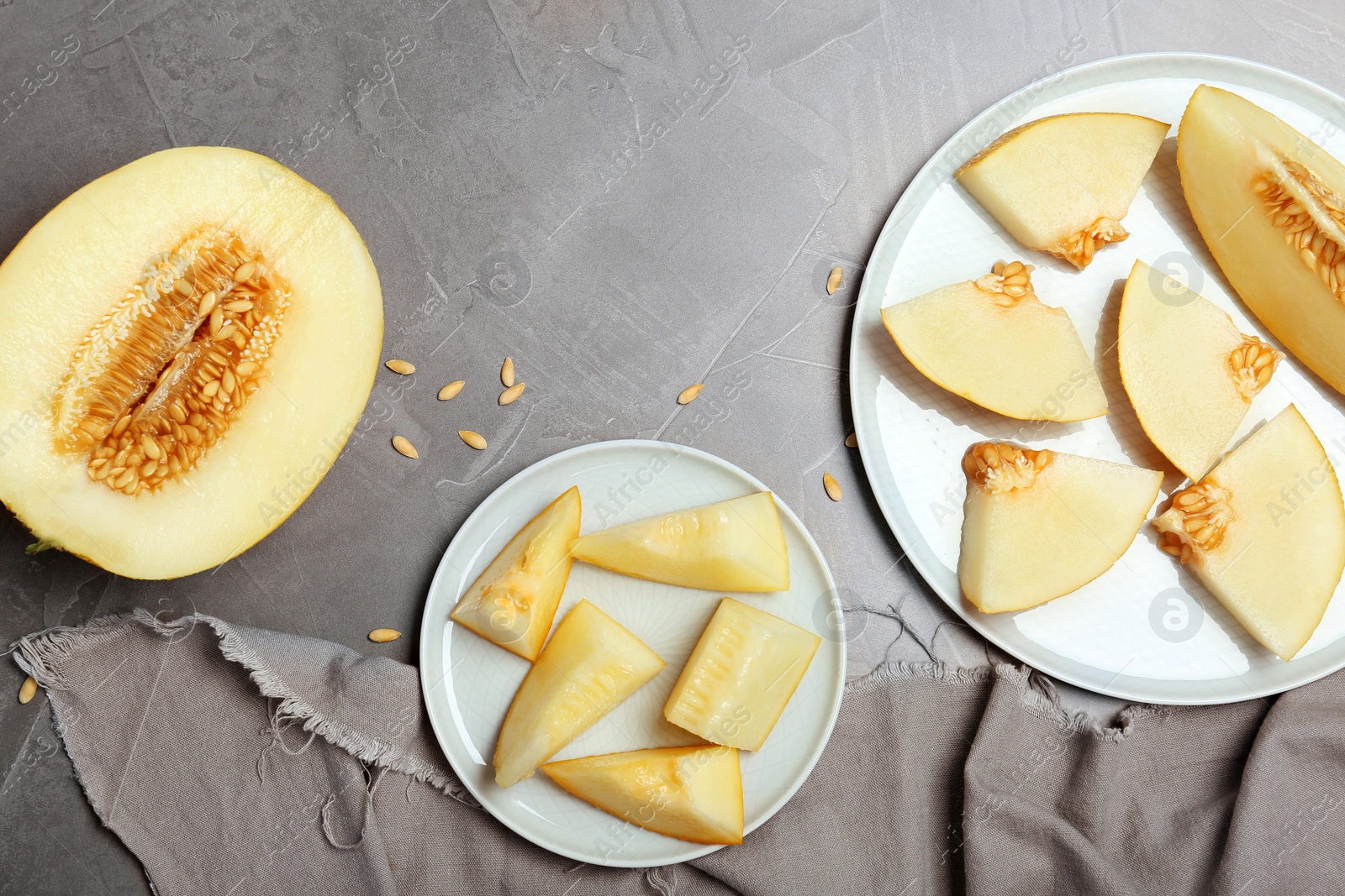 Photo of Flat lay composition with delicious cut melon on table