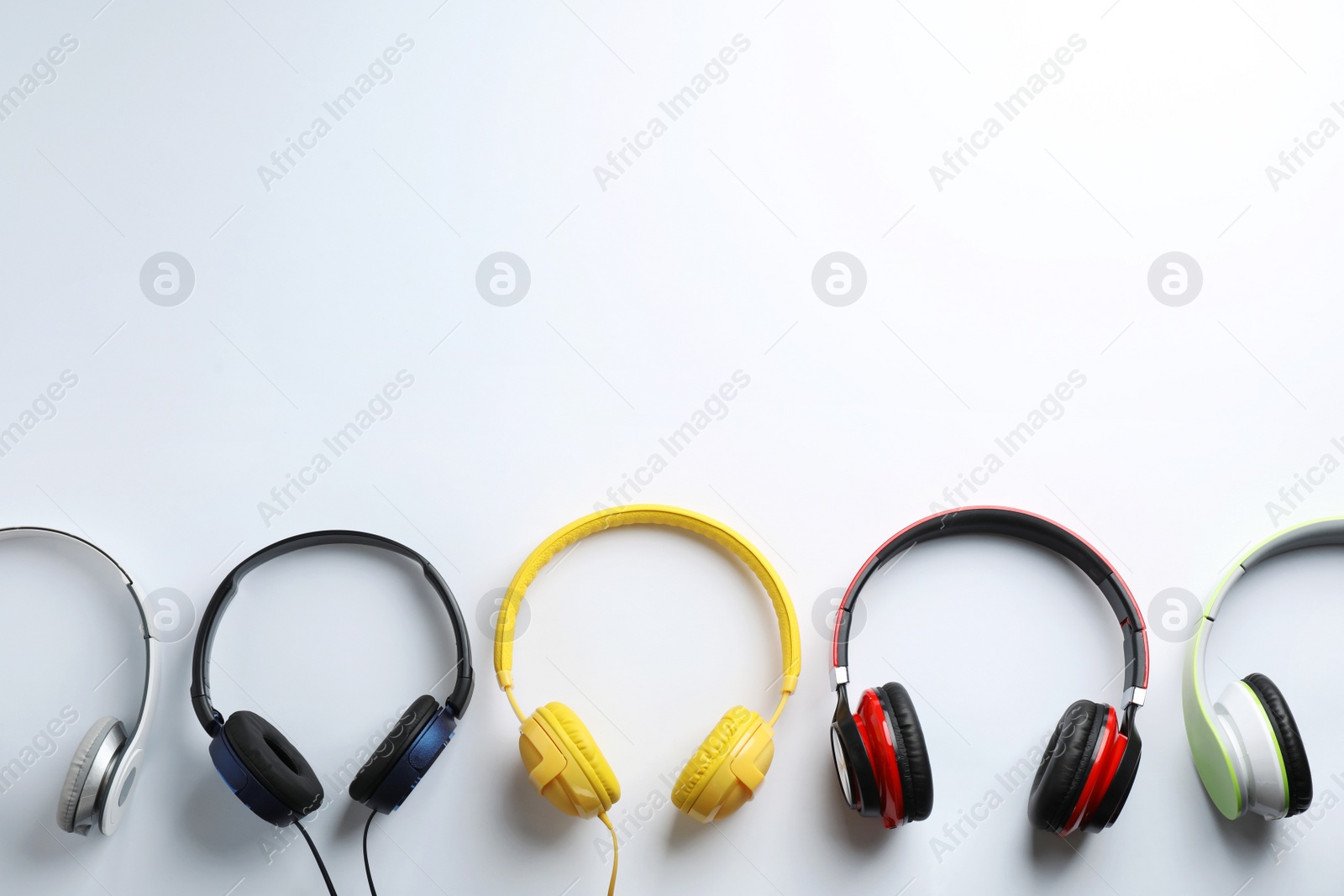 Photo of Stylish modern headphones with earmuffs on white background