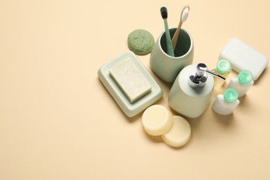 Bath accessories. Flat lay composition with personal care products on beige background, space for text