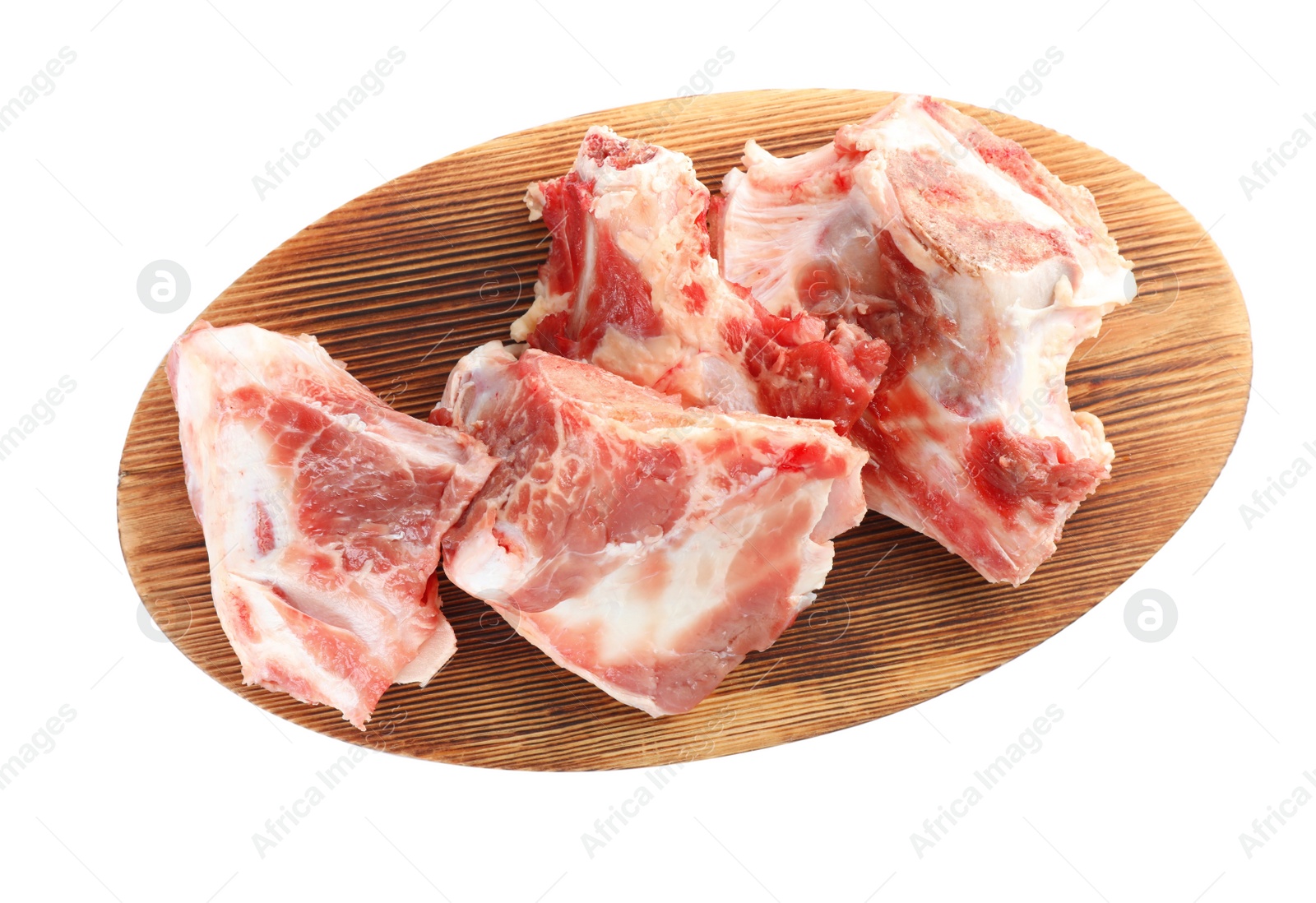 Photo of Wooden board with raw chopped meaty bones on white background, top view