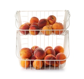 Stand with fresh sweet peaches on white background