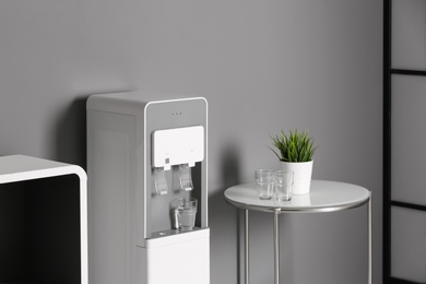 Modern water cooler in stylish office interior