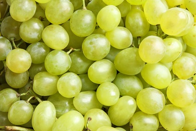 Photo of Fresh ripe juicy white grapes as background, closeup view