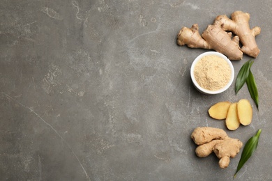 Flat lay composition with fresh and dry ginger on grey table. Space for text