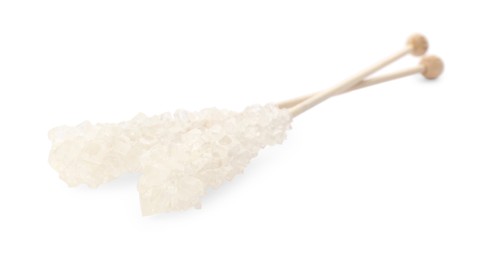 Photo of Wooden sticks with sugar crystals isolated on white. Tasty rock candies