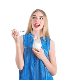 Young woman with yogurt on white background