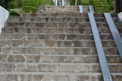 View of empty concrete staircase with stone fragments outdoors