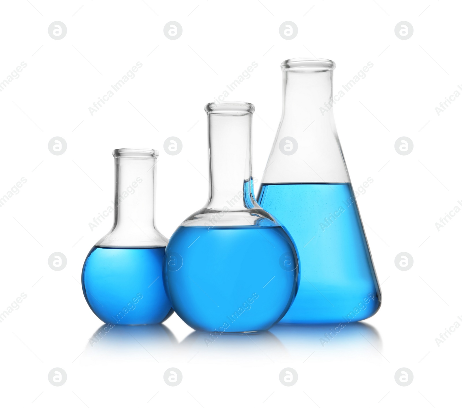 Photo of Florence and conical flasks with blue liquid on white background. Laboratory glassware