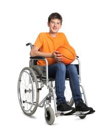 Photo of Disabled teenage boy in wheelchair with basketball ball on white background
