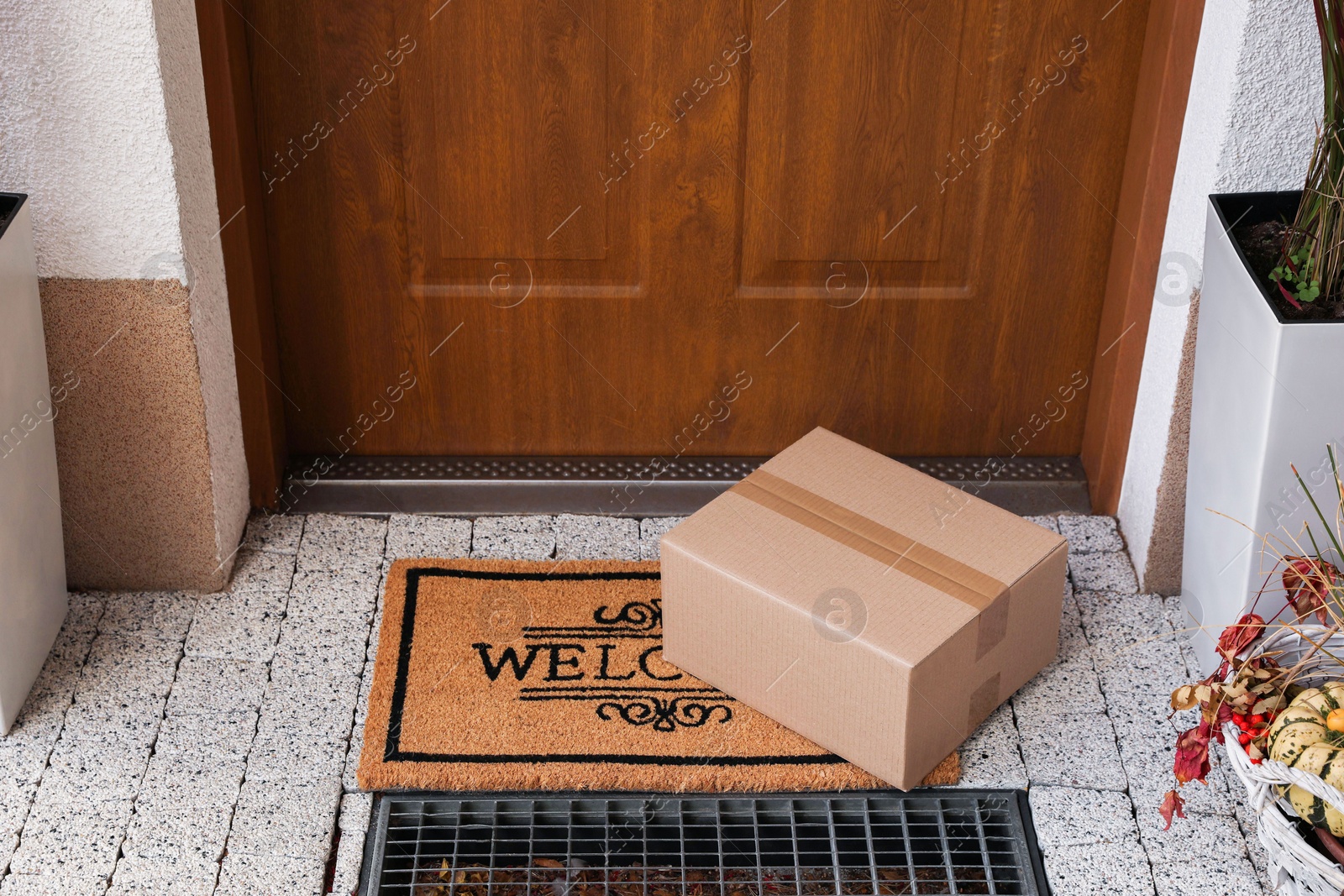 Photo of Parcel delivered on mat near front door