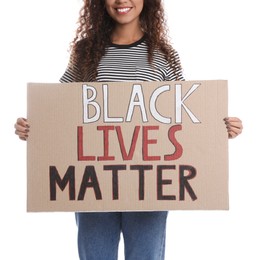 Photo of African American woman holding sign with phrase Black Lives Matter on white background, closeup. Racism concept