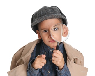 Photo of Little boy with magnifying glass playing detective on white background