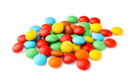 Photo of Many small colorful candies on white background